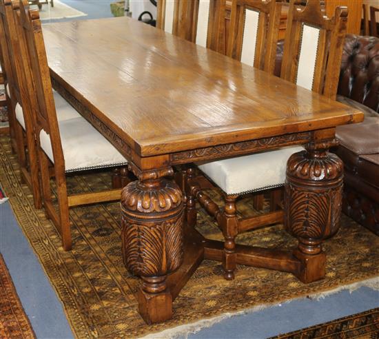 A 17th century style oak refectory table W.259cm.